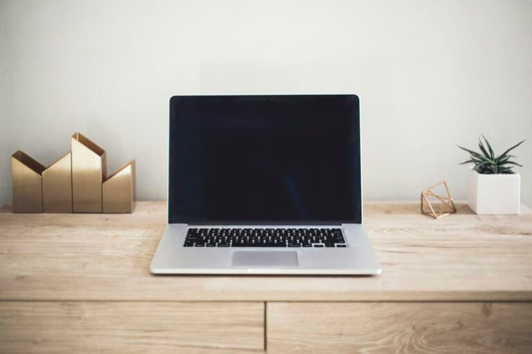 Laptop on a desk, ready for an online consultation
