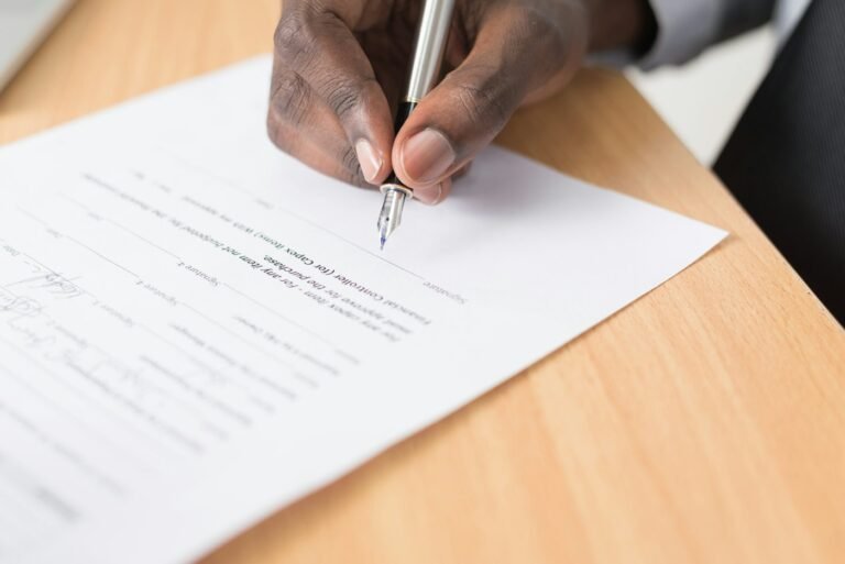 Person signing a legal document
